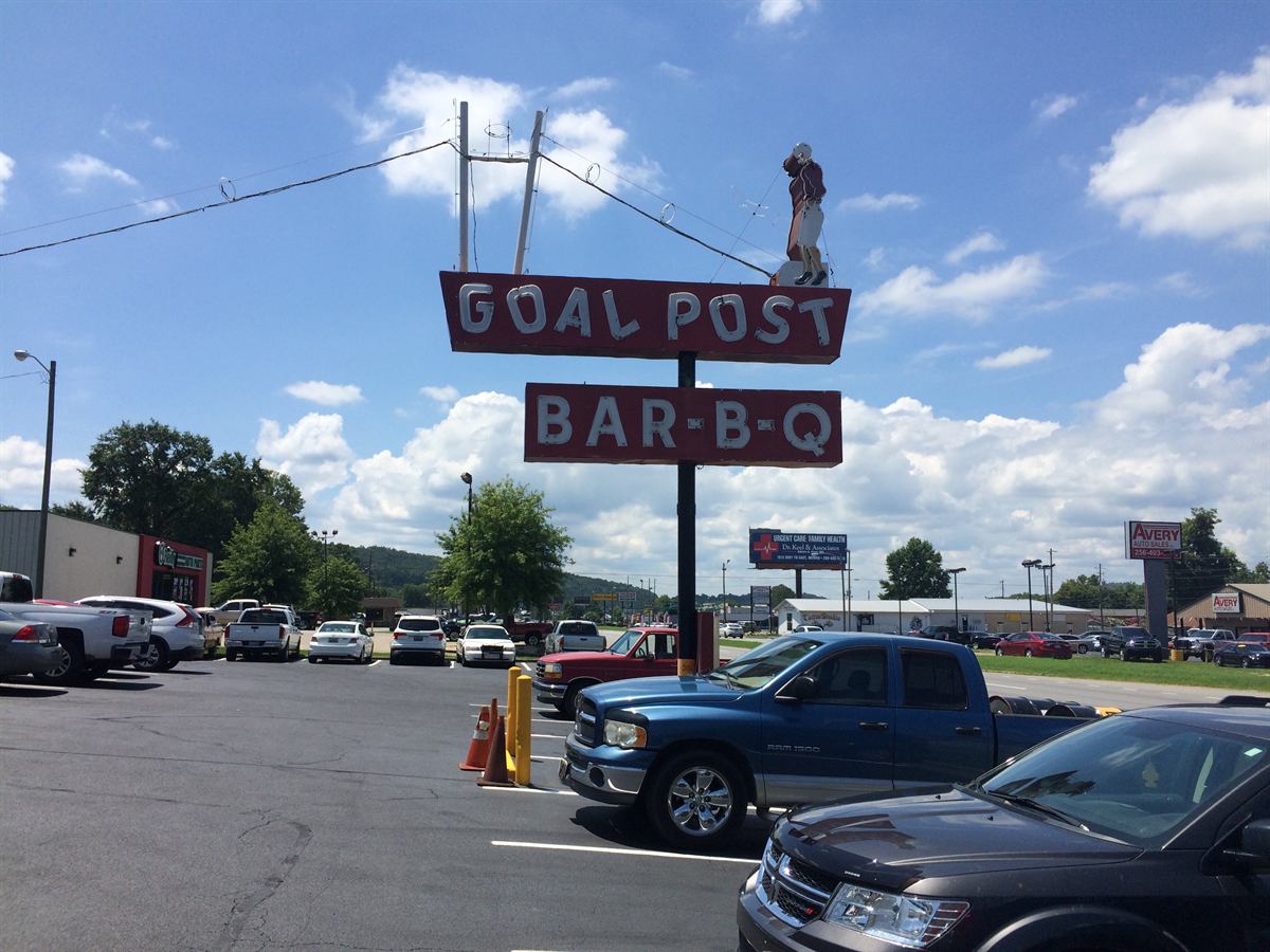 The old Goal Post Bar-B-Q sign standing over the parking lot on Quintard Avenue