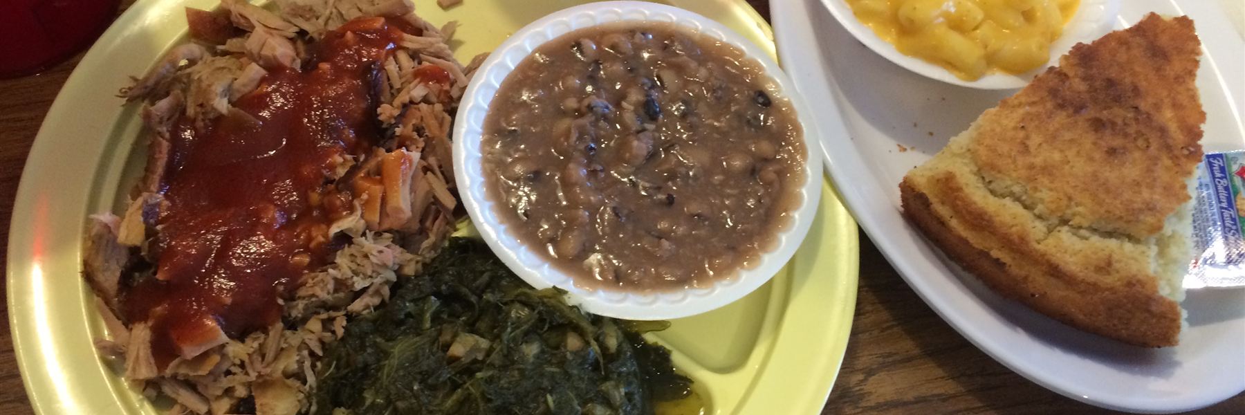 Betty's Bar-B-Q pork plate with turnip greens, pinto beans, mac and cheese and cornbread