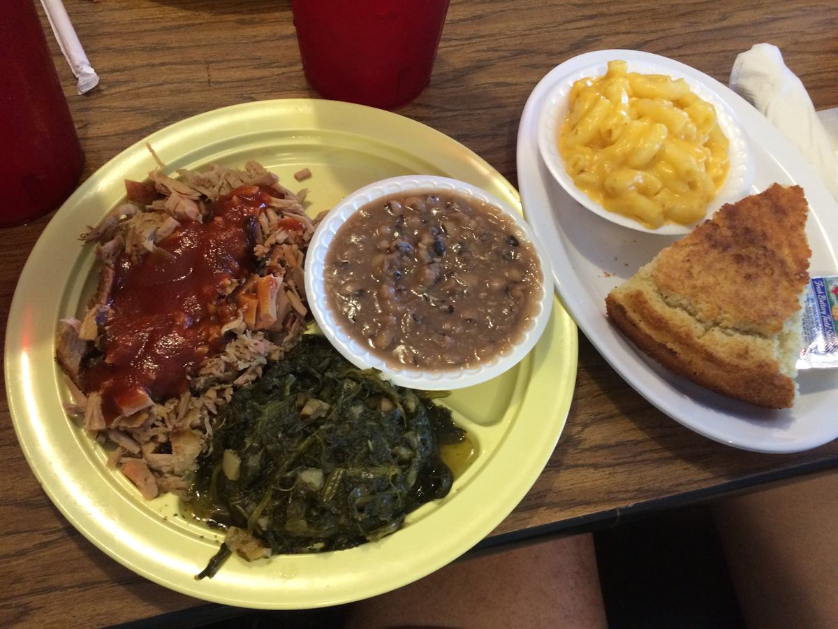 BBQ pork plate with turnip greens, pinto beans, mac and cheese and cornbread