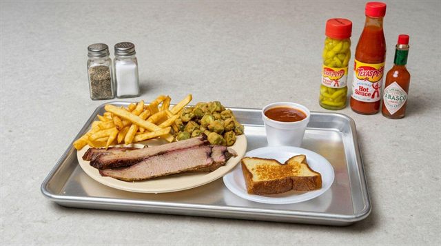 BBQ brisket with fries, fried okra, and BBQ bread at Betty's Bar-B-Q in Anniston, AL