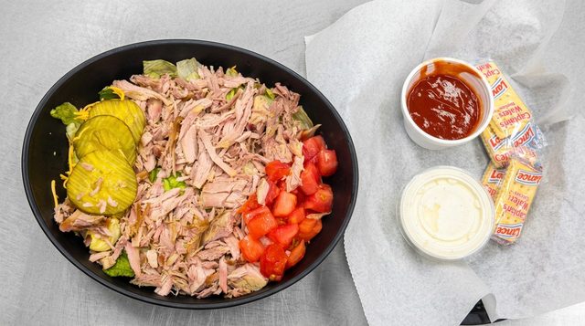 Bar-B-Q pork salad with pickles and chopped tomato, served with barbecue sauce and dressing, at Betty's Bar-B-Q in Anniston, AL