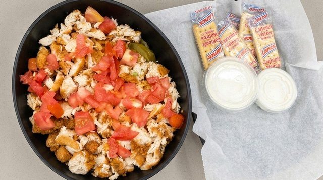 Chicken finger salad with chopped tomato, ranch dressing and crackers at Betty's Bar-B-Q in Anniston, AL