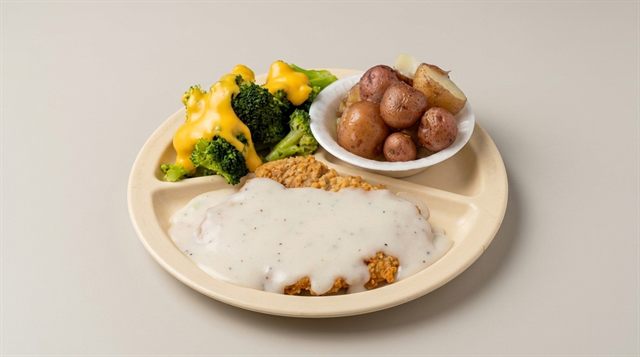 Country fried steak with white gravy, stewed potatoes, and broccoli and cheese at Betty's Bar-B-Q in Anniston, AL