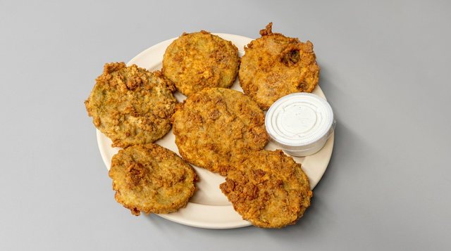 Plate of double dipped fried green tomatoes served with ranch at Betty's Bar-B-Q in Anniston, AL