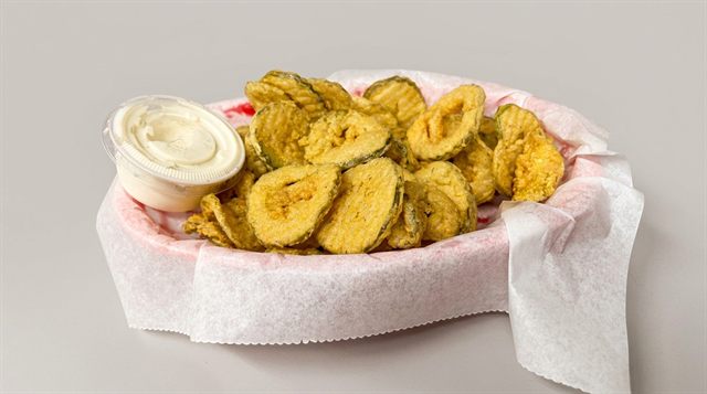 A basket of fried dill pickle chips served with a side of ranch from Betty's Bar-B-Q in Anniston, AL