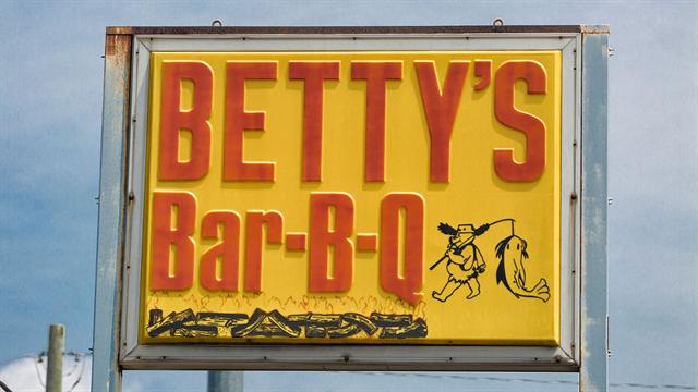 Betty's Bar-B-Q yellow roadside sign